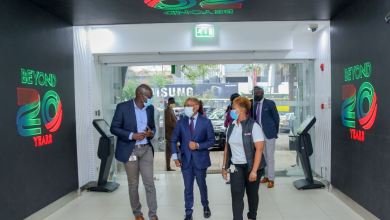 Safaricom HOD Retail Strategy, Franchise and Mobile Care Yudah Yogo, Safaricom Chief Executive Officer Peter Ndegwa, being taken around the newly refurbished shop with Sarah Indetie-Senior Manager Retail Asset Management during the launch of the heavy tech store in Moi avenue. This first-of-a-kind digitized flagship shop has a video tunnel at the entrance, digital interactive screens and device display screens for a wide variety of phones and accessories on sale.