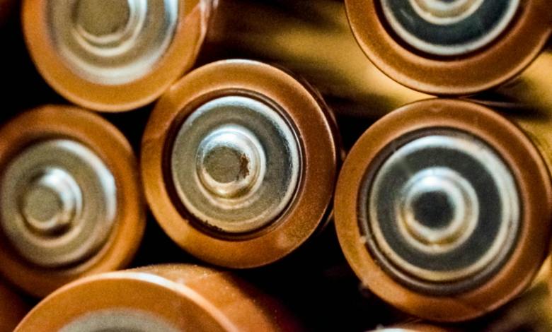 close up photo of batteries Li-ion battery demand rises, driven by EV growth; shifts to cost-effective materials like LFP, LMFP, and artificial graphite dominate market trends.